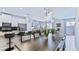Bright open-concept living space with stylish kitchen, dining, and living areas at 1563 Sandbagger Dr, Davenport, FL 33896