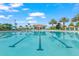 Large swimming pool with poolside bar and plenty of lounge chairs for relaxing at 1563 Sandbagger Dr, Davenport, FL 33896