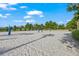 Enjoy a game of volleyball on this sandy court surrounded by lush landscaping at 1563 Sandbagger Dr, Davenport, FL 33896