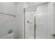 Clean bathroom featuring a glass enclosed shower, white tile, and modern fixtures at 1570 Sandbagger Dr, Davenport, FL 33896
