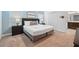 Comfortable bedroom featuring a large bed with nightstands, closet space, and carpeted floors at 1570 Sandbagger Dr, Davenport, FL 33896