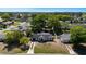 Aerial view of the house, detached garage, and yard surrounded by mature trees at 188 Citrus Dr, Kissimmee, FL 34743