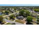 Aerial view of the property showcasing its proximity to neighboring homes and lush greenery at 188 Citrus Dr, Kissimmee, FL 34743