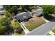 Birds eye view of a single-Gathering home featuring a well-maintained lawn and detached garage at 188 Citrus Dr, Kissimmee, FL 34743