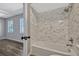 Recently remodeled bathroom features tub, shower, and updated tile at 188 Citrus Dr, Kissimmee, FL 34743