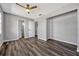This large bedroom features multiple doors and a ceiling fan at 188 Citrus Dr, Kissimmee, FL 34743