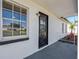A close up of a front door with a front window and a white exterior at 188 Citrus Dr, Kissimmee, FL 34743