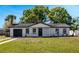 Charming single-story home with a well-maintained lawn, front porch, and a one-car garage at 188 Citrus Dr, Kissimmee, FL 34743