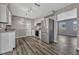Modern kitchen with stainless steel appliances, granite countertops, and beautiful vinyl flooring at 188 Citrus Dr, Kissimmee, FL 34743