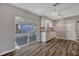 Modern kitchen featuring stainless appliances, white cabinets and direct access to the screened porch at 188 Citrus Dr, Kissimmee, FL 34743