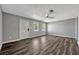 An open living room with luxury vinyl plank flooring and a ceiling fan at 188 Citrus Dr, Kissimmee, FL 34743