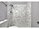 Close-up of the bathroom showcasing the tiled shower with rainfall showerhead and mosaic shower floor at 188 Citrus Dr, Kissimmee, FL 34743
