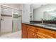 Bathroom featuring a glass-enclosed shower, granite countertop, and wood vanity at 201 Walter Stevens Way, Deland, FL 32724