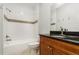 Bathroom featuring vanity with granite countertop, shower with tub, and mosaic tile accent at 201 Walter Stevens Way, Deland, FL 32724