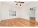 Spacious bedroom featuring wood floors and a large window offering lots of natural light at 201 Walter Stevens Way, Deland, FL 32724