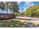 Well-maintained brick entrance to Carriage Homes neighborhood at 201 Walter Stevens Way, Deland, FL 32724