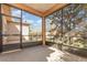 Screened patio features neutral flooring and screens allowing views of the green backyard at 201 Walter Stevens Way, Deland, FL 32724