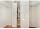 Walk-in closet provides ample storage space, leading into an ensuite bathroom with shower at 201 Walter Stevens Way, Deland, FL 32724