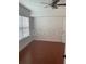 Cozy bedroom with wood flooring, and a bright window offering ample natural light at 204 E South St # 5057, Orlando, FL 32801