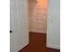 Walk-in closet with built-in shelving and hardwood floors at 204 E South St # 5057, Orlando, FL 32801