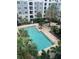Inviting swimming pool surrounded by lush tropical landscaping, offering a serene outdoor retreat at 204 E South St # 5057, Orlando, FL 32801