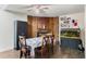 Inviting dining room with brick fireplace, wood-look flooring and decorative accents at 2357 Town And Country Dr, Kissimmee, FL 34744