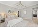 Spacious bedroom with ample natural light, light wood floors, and ensuite bathroom access at 2527 Mohawk Trl, Maitland, FL 32751