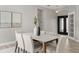 Dining room featuring modern decor, contemporary lighting and a view of the front door at 2527 Mohawk Trl, Maitland, FL 32751