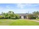 Charming single-story home with lush landscaping and a well-manicured lawn at 2527 Mohawk Trl, Maitland, FL 32751