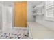 Home office area with built-in shelves and a view of a bright window at 2527 Mohawk Trl, Maitland, FL 32751