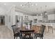 Bright and airy kitchen with stainless steel appliances integrated with the dining area at 2527 Mohawk Trl, Maitland, FL 32751