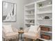 Charming living room showcasing comfortable seating, modern decor, and built-in shelving at 2527 Mohawk Trl, Maitland, FL 32751