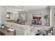 Spacious open concept living area with seamless transition to the modern kitchen at 2527 Mohawk Trl, Maitland, FL 32751