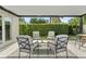 Stylish covered patio featuring comfortable seating and a lush green backdrop providing a serene outdoor retreat at 2527 Mohawk Trl, Maitland, FL 32751
