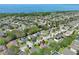 An aerial view of a neighborhood with a lake in the background showing the location of the home at 2545 Azzurra Ln, Ocoee, FL 34761