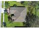 Aerial view of a home featuring a well-maintained roof, a brick driveway, and mature landscaping at 2545 Azzurra Ln, Ocoee, FL 34761