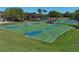 A full basketball court with hoops on each end and seating area with a covered picnic shelter at 2545 Azzurra Ln, Ocoee, FL 34761