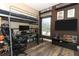 Teen bedroom with a lofted bed, wood floors, and a large TV at 2545 Azzurra Ln, Ocoee, FL 34761