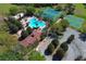 Aerial view of community pool and tennis courts located near the neighborhood clubhouse at 2545 Azzurra Ln, Ocoee, FL 34761