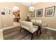 Dining room features a glass table, modern decor, and a view into the adjacent kitchen at 2545 Azzurra Ln, Ocoee, FL 34761