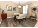 Features a modern chandelier, stylish furniture, and luxury vinyl plank flooring at 2545 Azzurra Ln, Ocoee, FL 34761