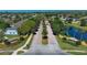 View of the entrance with lush landscaping and palm trees in a well-maintained neighborhood at 2545 Azzurra Ln, Ocoee, FL 34761