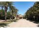 The entryway into the community includes a paved brick road and a security gate at 2545 Azzurra Ln, Ocoee, FL 34761