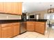 Beautiful kitchen with stainless steel appliances, granite countertops, and ample cabinet space at 2545 Azzurra Ln, Ocoee, FL 34761