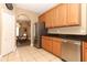 Bright kitchen features stainless steel appliances, tile flooring, and ample cabinet space at 2545 Azzurra Ln, Ocoee, FL 34761