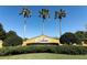 Community sign for Destyn Bay with palm trees towering above a manicured landscape at 2545 Azzurra Ln, Ocoee, FL 34761