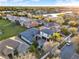 Aerial view showing a home in a residential neighborhood with a lake in the background at 2680 Lookout Ln, Kissimmee, FL 34746