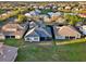 Sprawling aerial view of single Gathering homes with screened in patios and lush green lawns within a neighborhood at 2680 Lookout Ln, Kissimmee, FL 34746