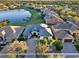 Aerial view of a home in a waterfront community with beautiful landscaping, docks, and serene water views at 2680 Lookout Ln, Kissimmee, FL 34746