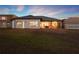 Exterior of home showing large yard, screened lanai and covered patio at 2680 Lookout Ln, Kissimmee, FL 34746